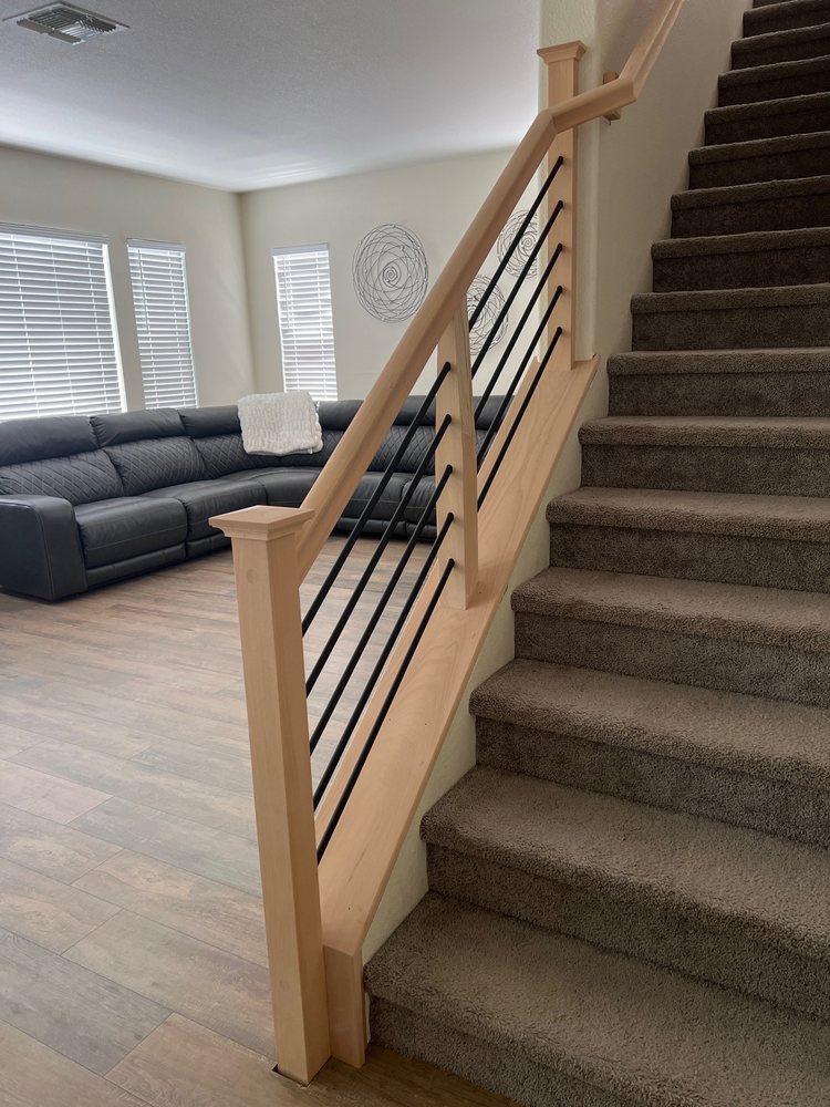 Modern stair renovation in Sacramento with natural wood railing and black horizontal balusters by iStairs